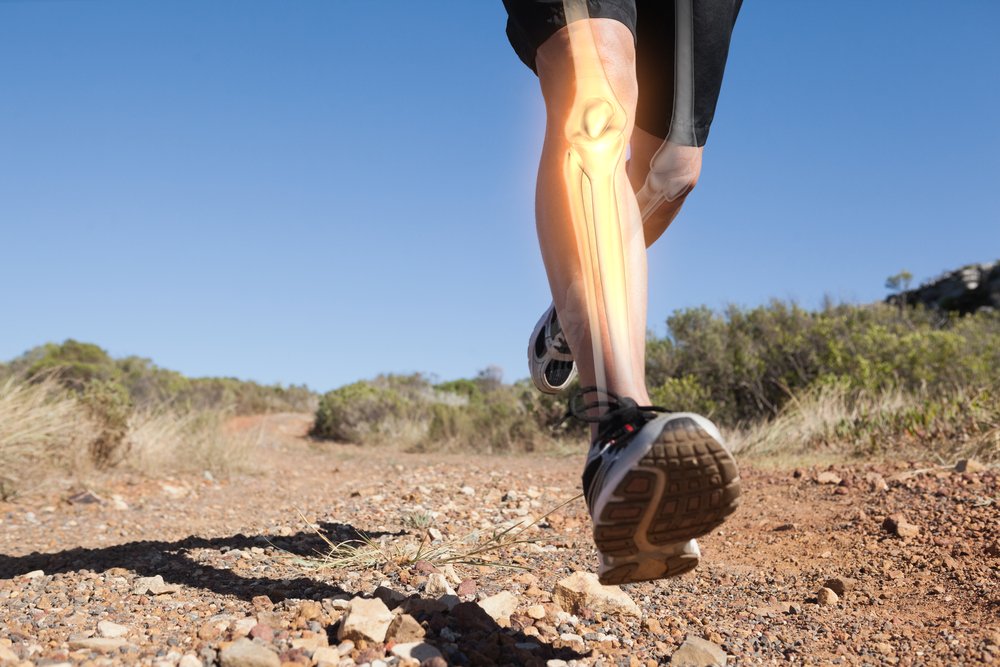 Digital-composite-of-Highlighted-leg-bones-of-jogging-man